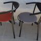 4 gondola-style chairs with a sturdy metal frame and faux leather.