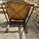 Antique Provençal armchair in wood with a straw seat.