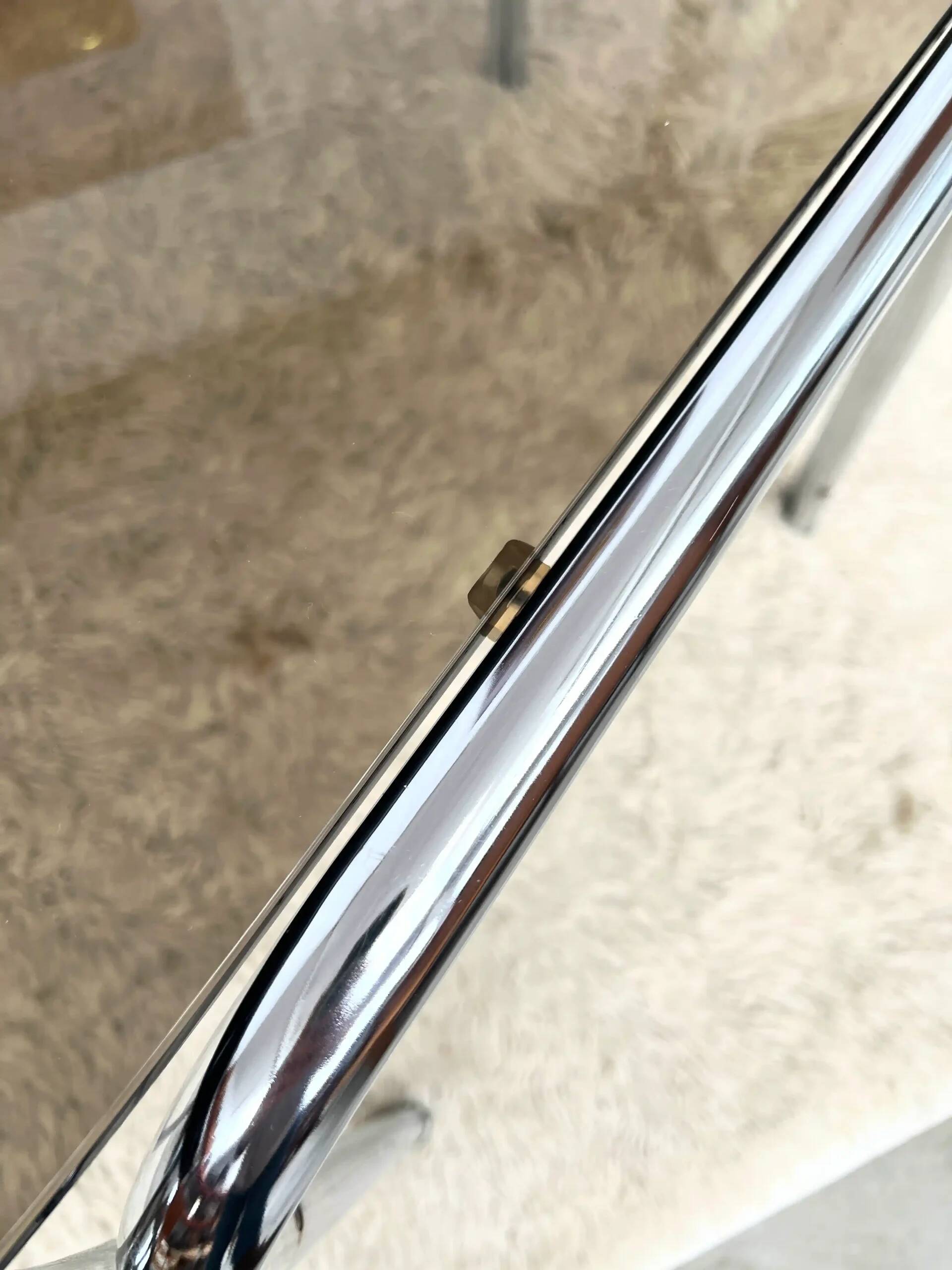 Vintage hexagonal table with smoked glass top and chrome metal structure.
