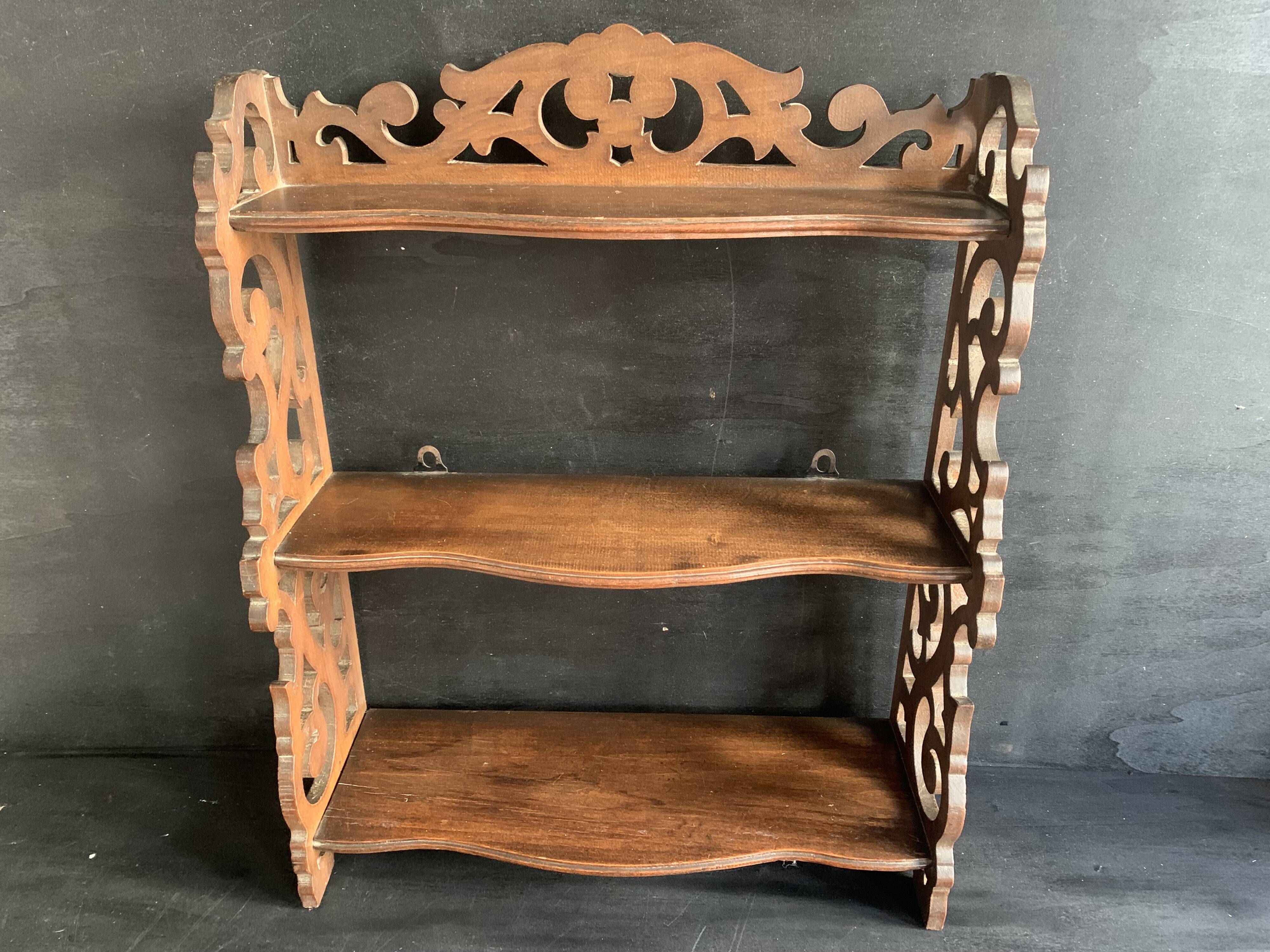 Antique shelf with openwork wooden pediment, early 20th century