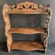 Antique shelf with openwork wooden pediment, early 20th century