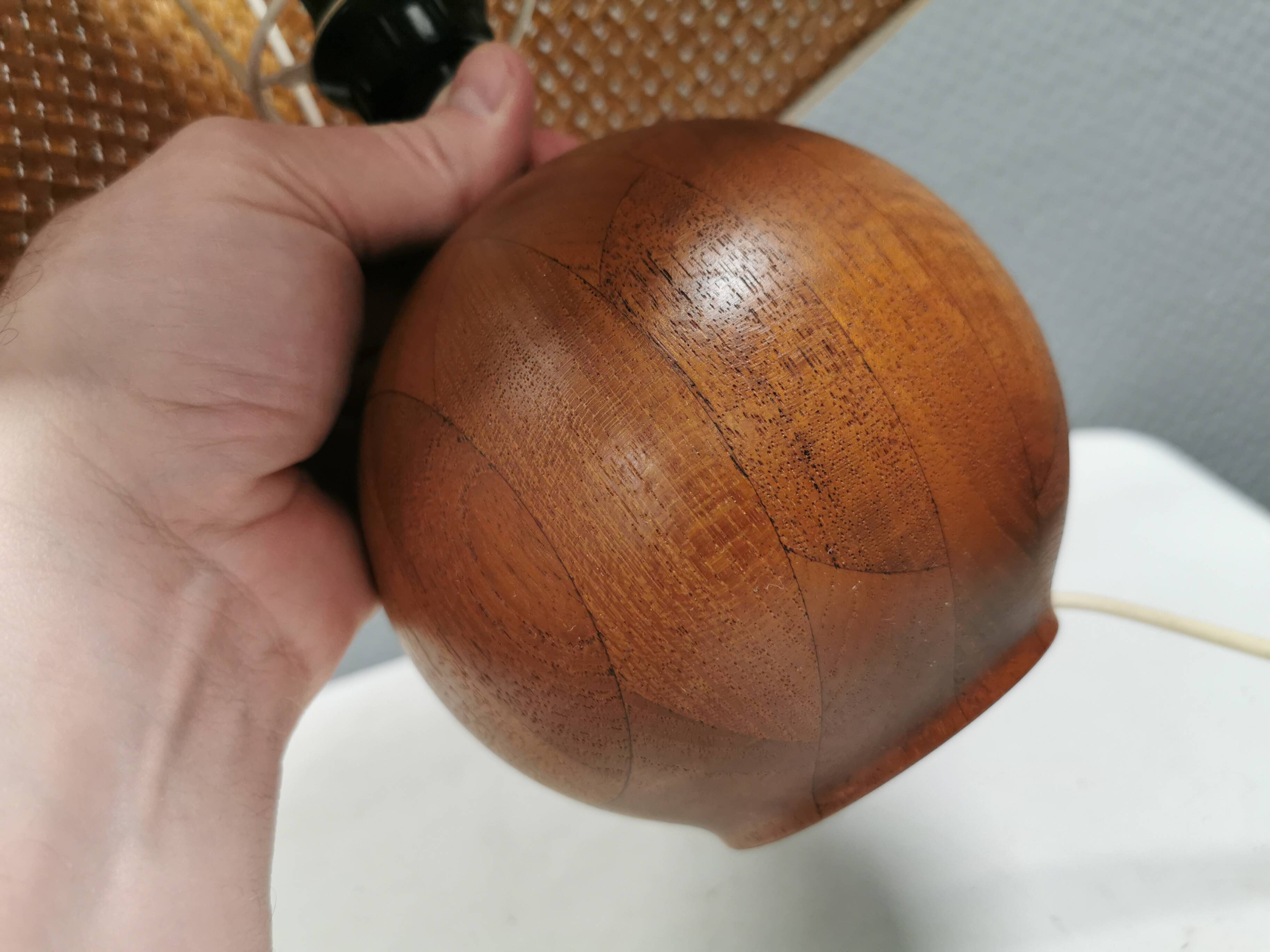 Very rare table lamp in turned teak wood with original braided shade. 1970s