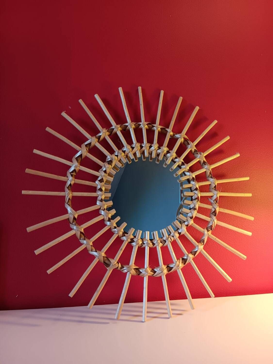 Vintage bohemian woven rattan sun mirror