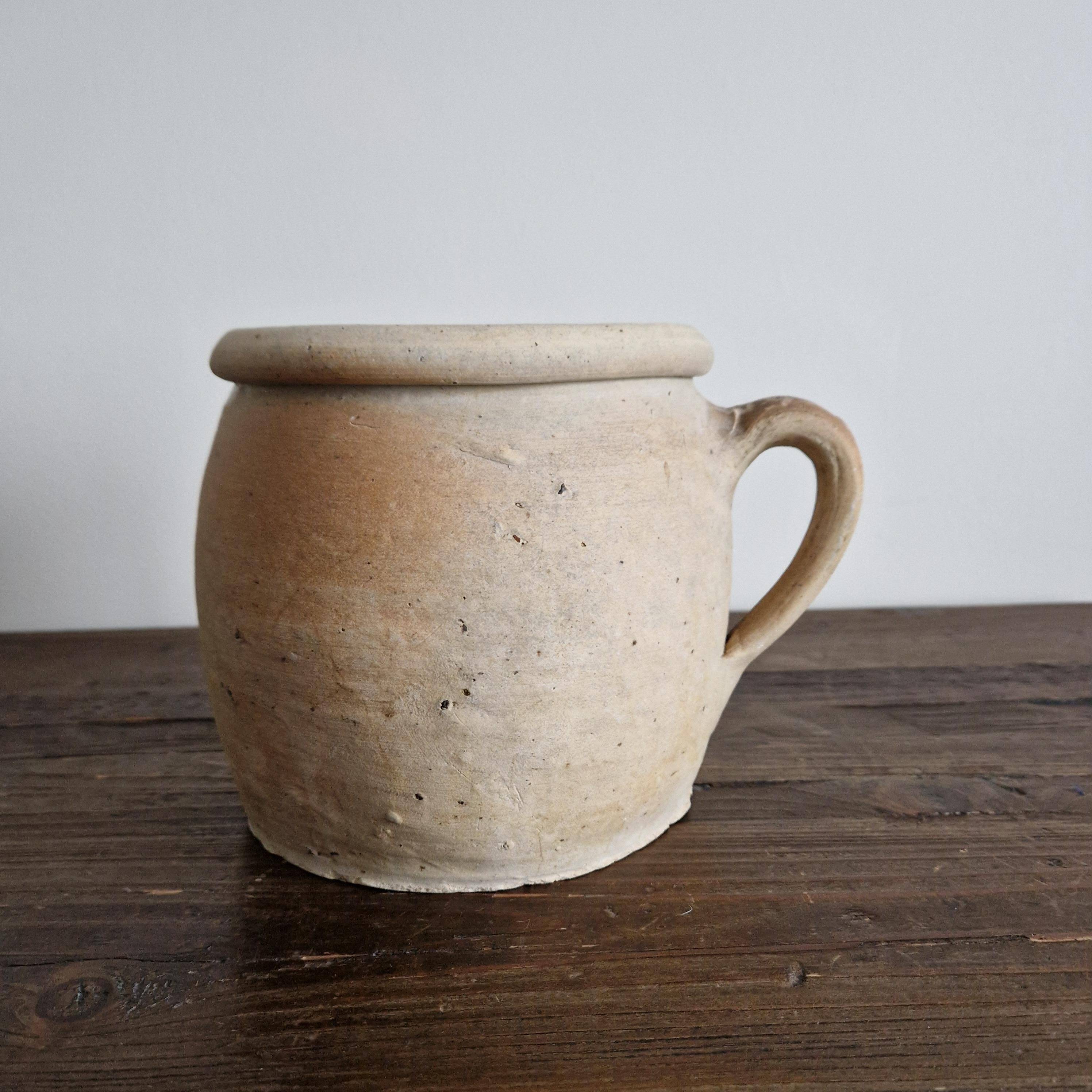 Ancient terracotta pot with a handle