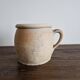 Ancient terracotta pot with a handle
