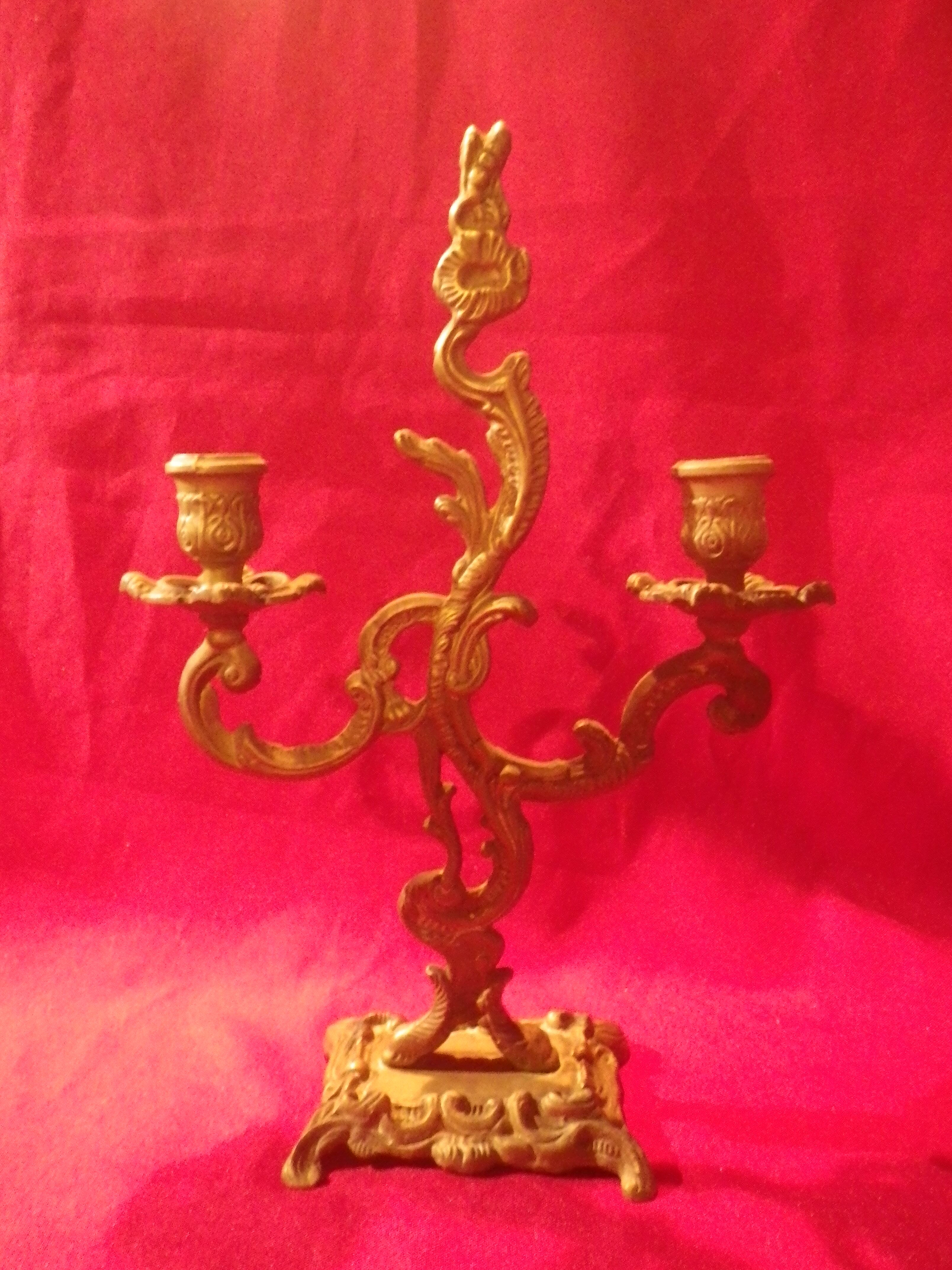 Two brass NCIAN candlesticks