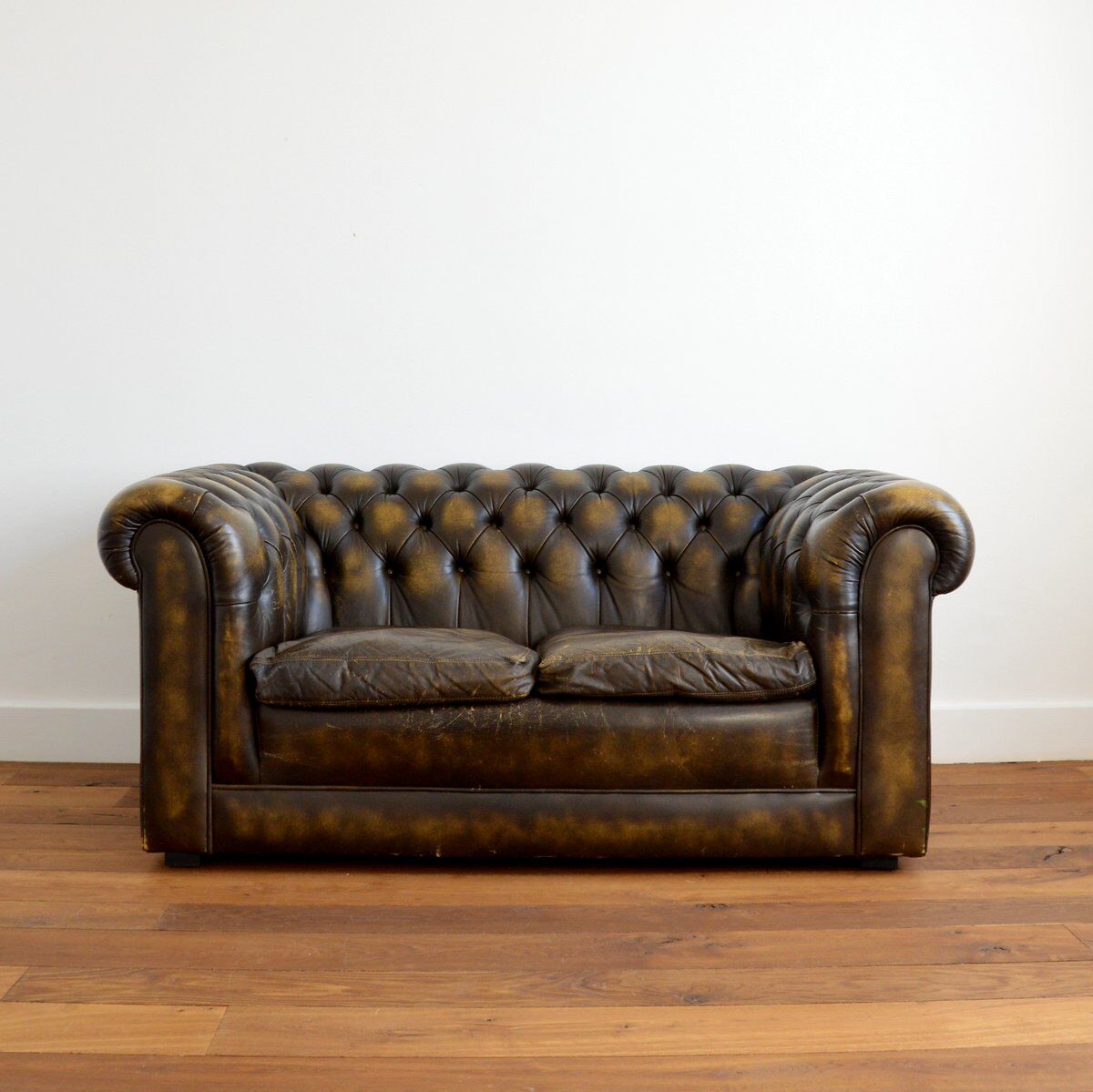 Vintage two-seater leather Chesterfield sofa
