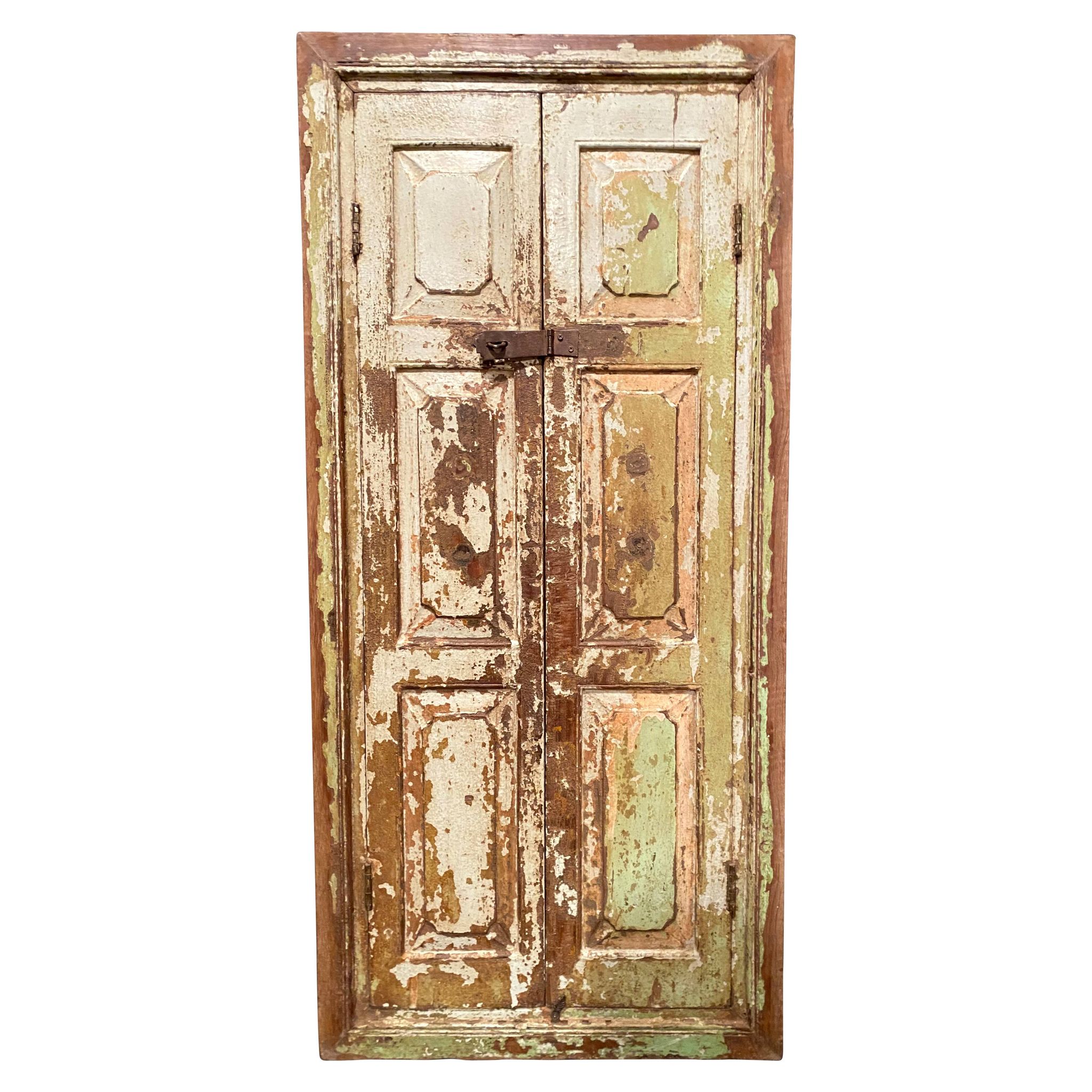 Indian window in green patinated wood