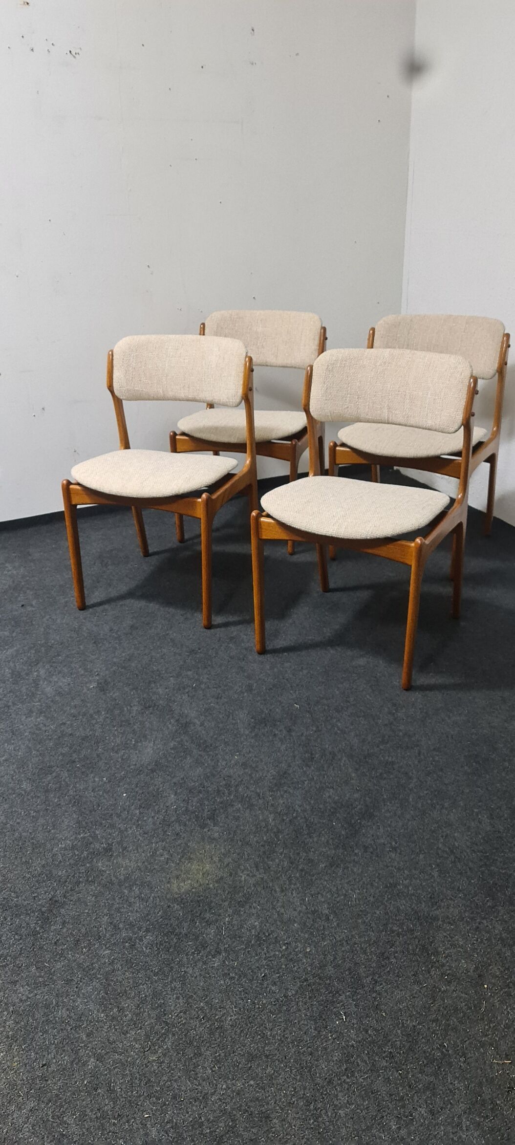 A set of four vintage teak dining chairs