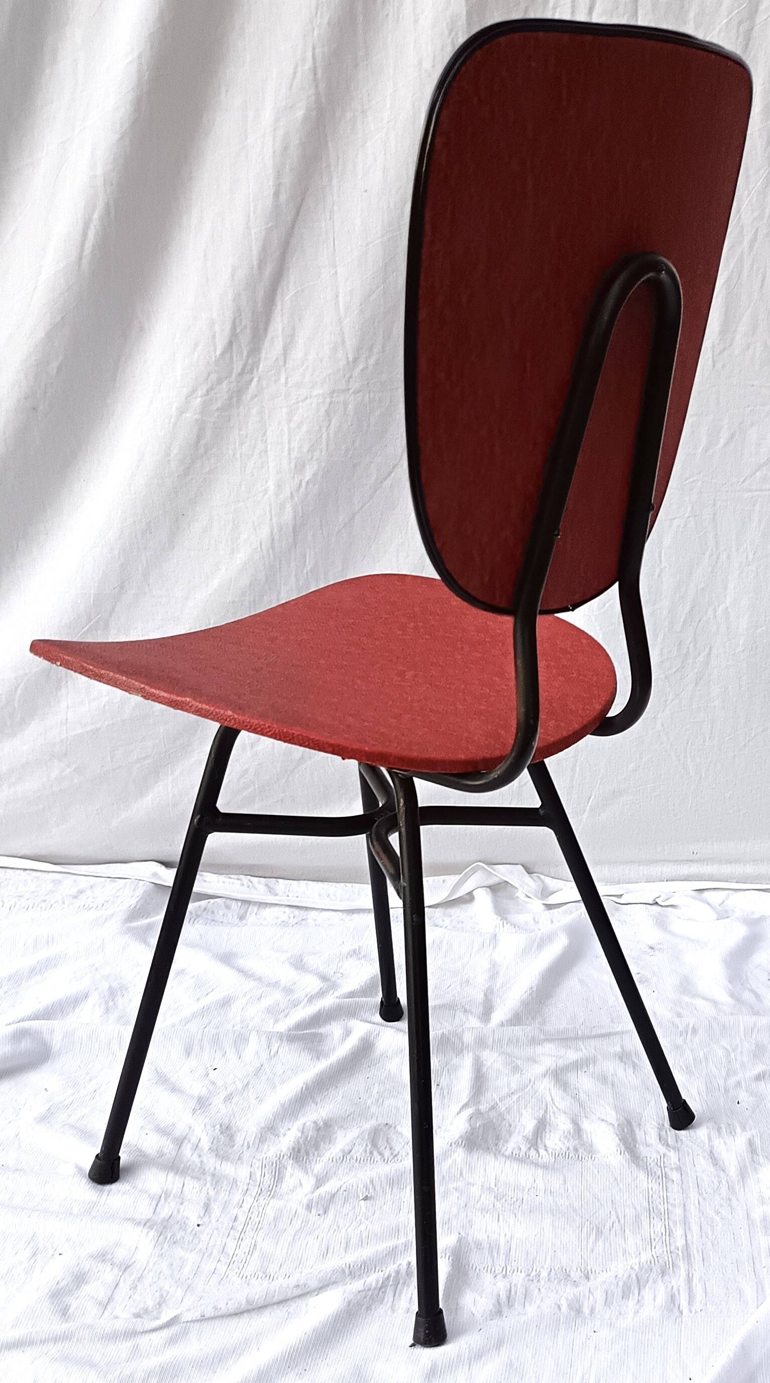 sixties chair with steel tube legs and a skaï seat