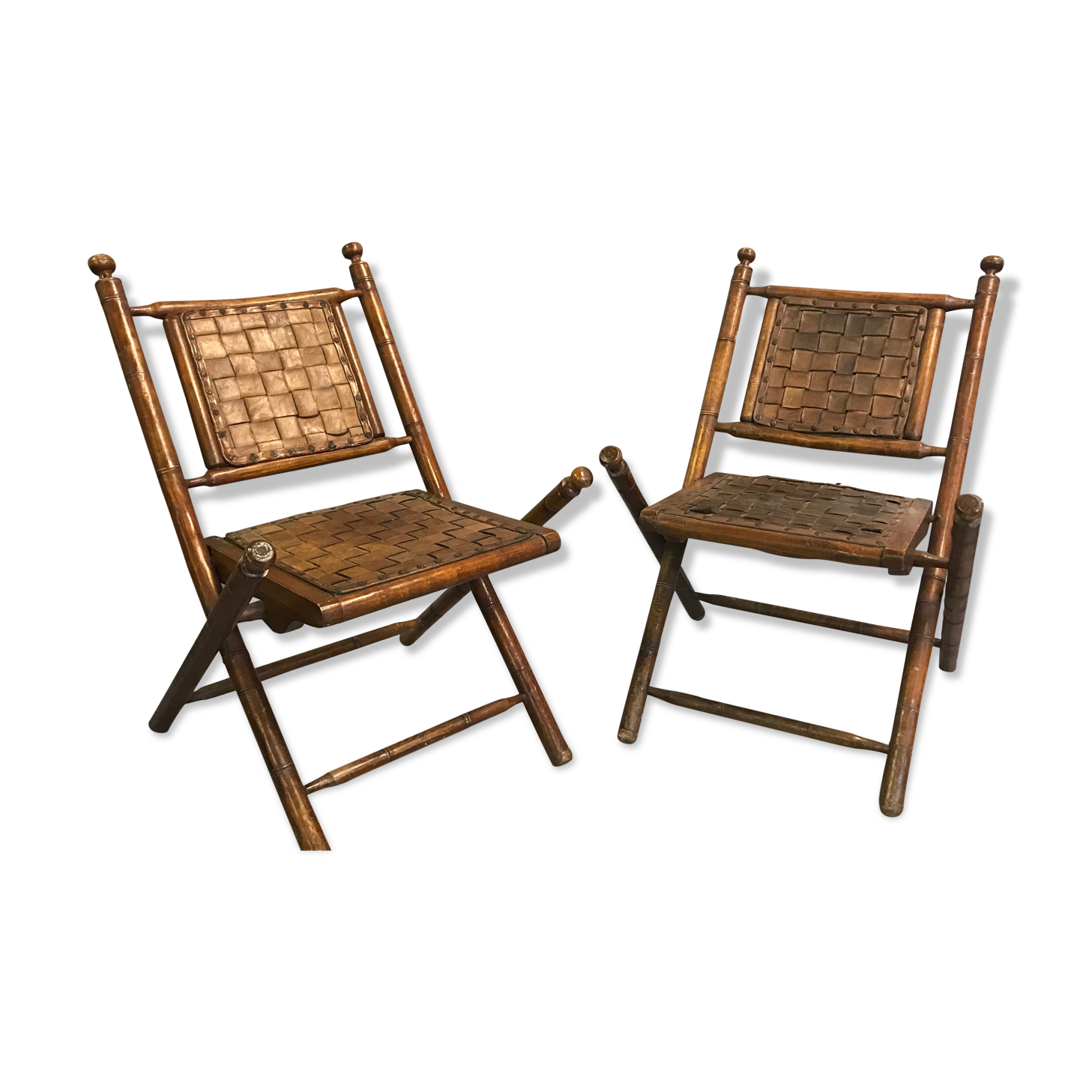 Former colonial armchairs in braided leather