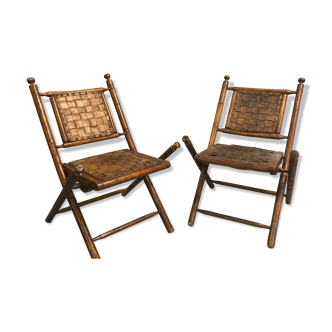 Former colonial armchairs in braided leather
