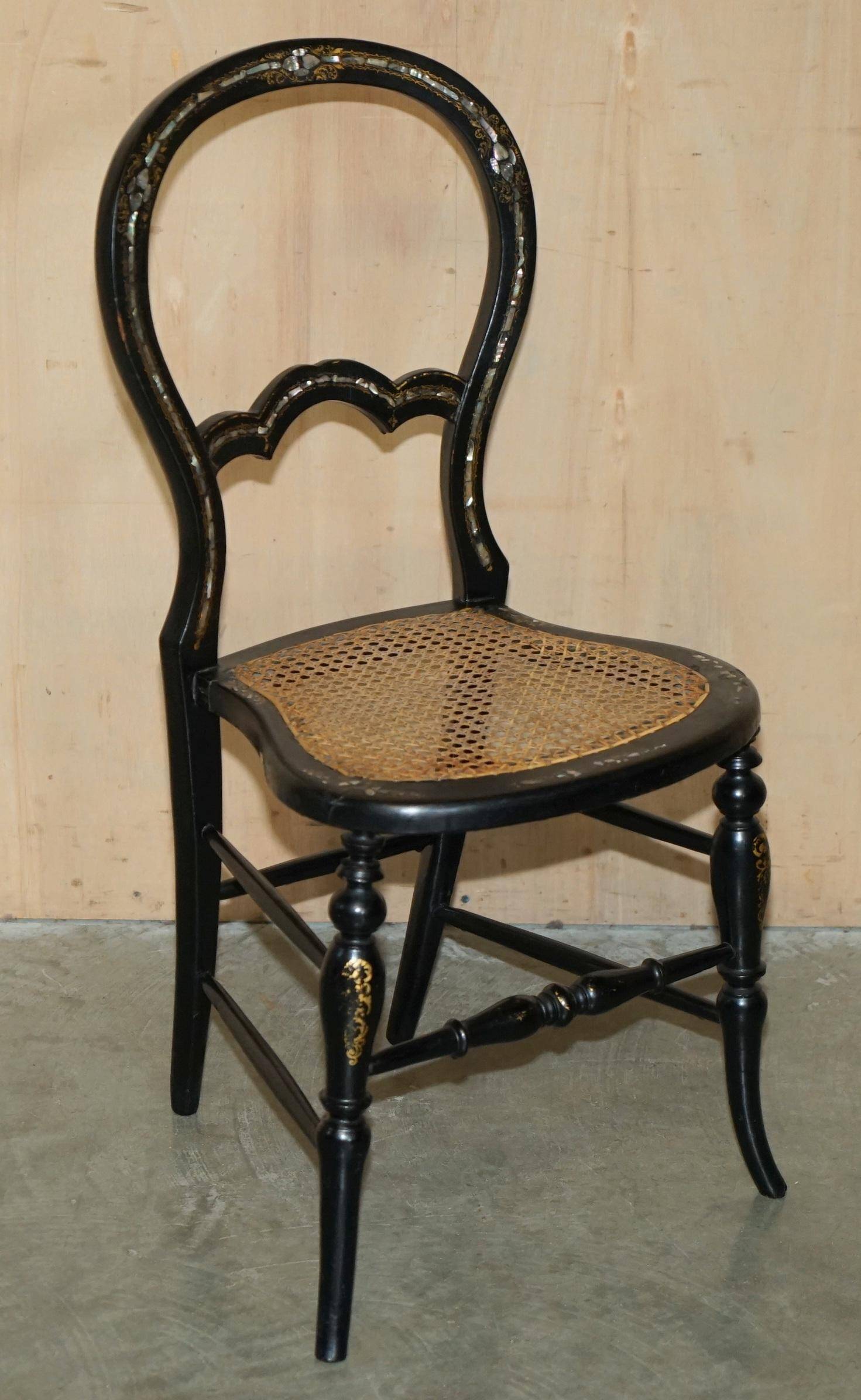Four antique Regency bergère chairs with mother-of-pearl inlay.