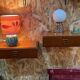Suspended teak bedside tables in vintage 1960s Scandinavian style.