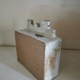 Vase architecture in raw sandstone.