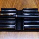 Old pen holder in black wood