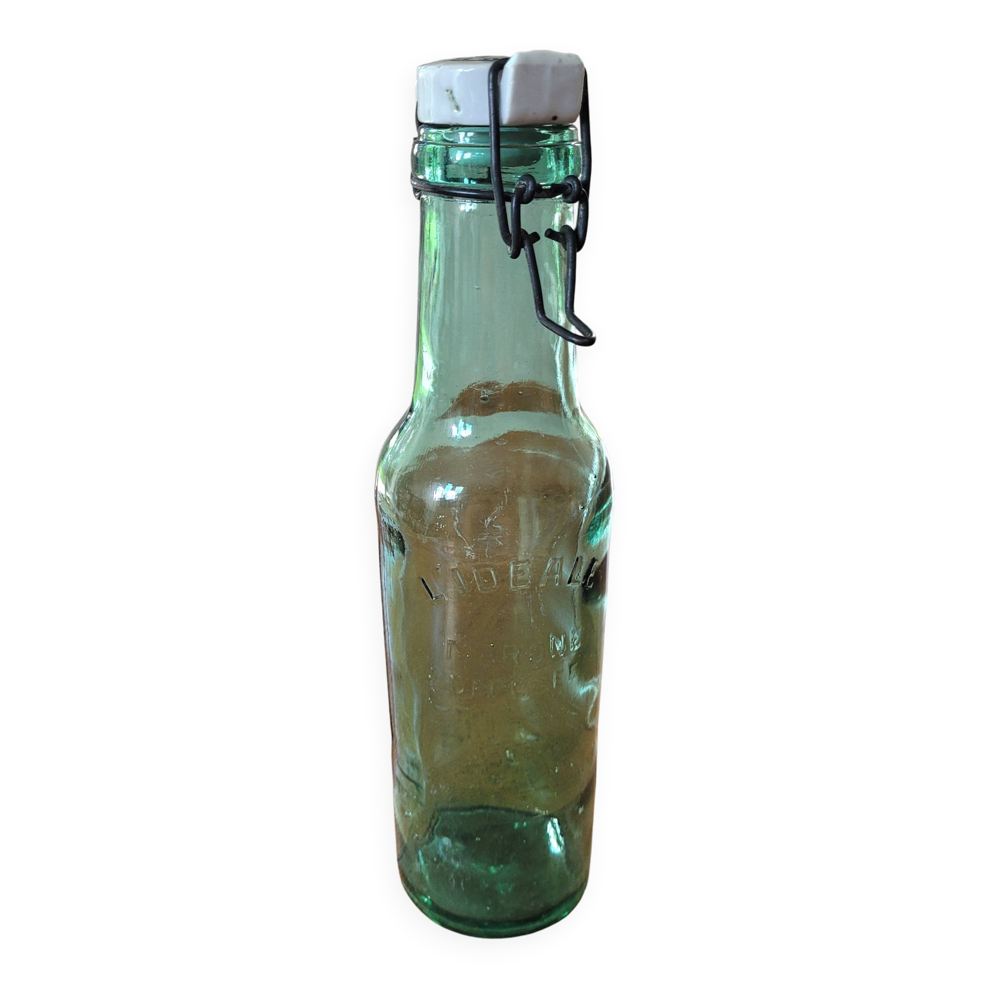 Vintage glass bottle l'Idéale with porcelain stopper
