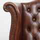Chesterfield wing chair in dark brown English cowhide