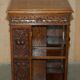 Victorian carved oak revolving library, circa 1880.