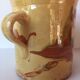 Glazed earth pitcher