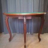 Half-moon mahogany game table on casters