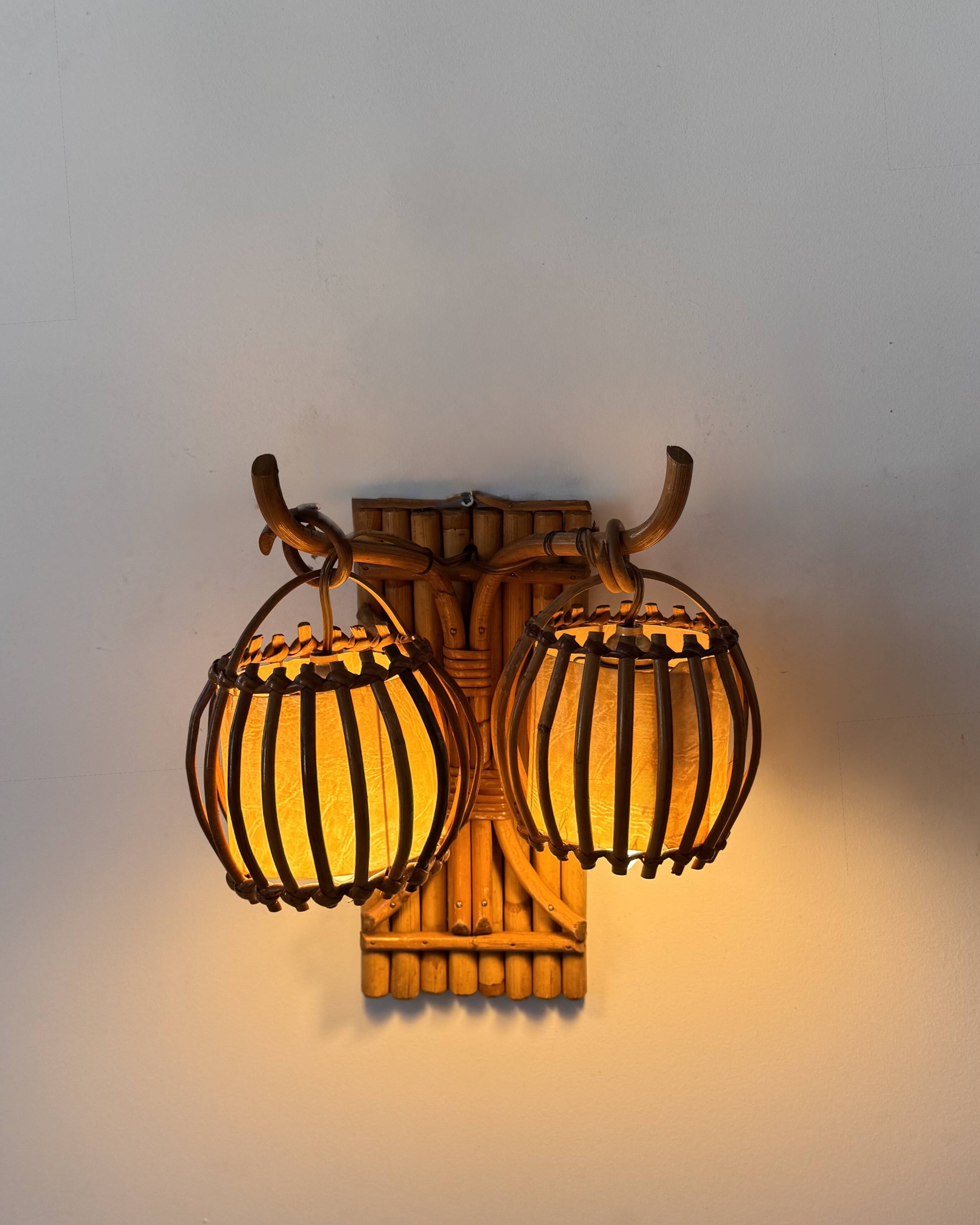 Vintage pair of rattan wall lights, France, 1950.