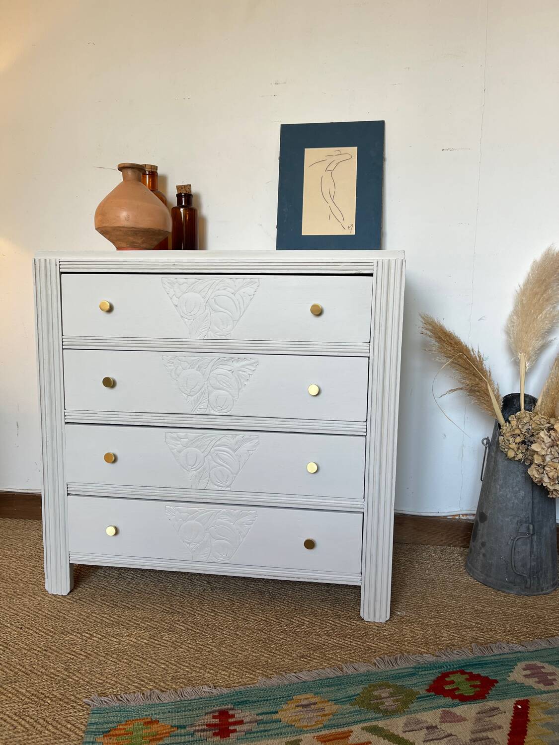 Restored wooden art deco chest of drawers with gilded handles