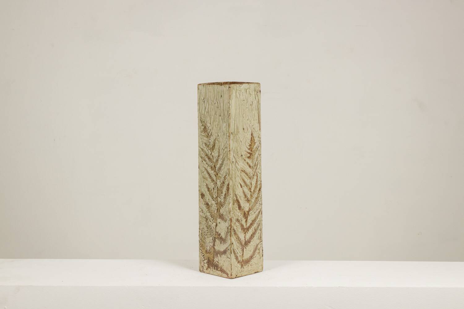 Brutalist stoneware vase with a plant motif. 1970s.