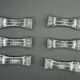 6 stylized glass knife holders knot shape
