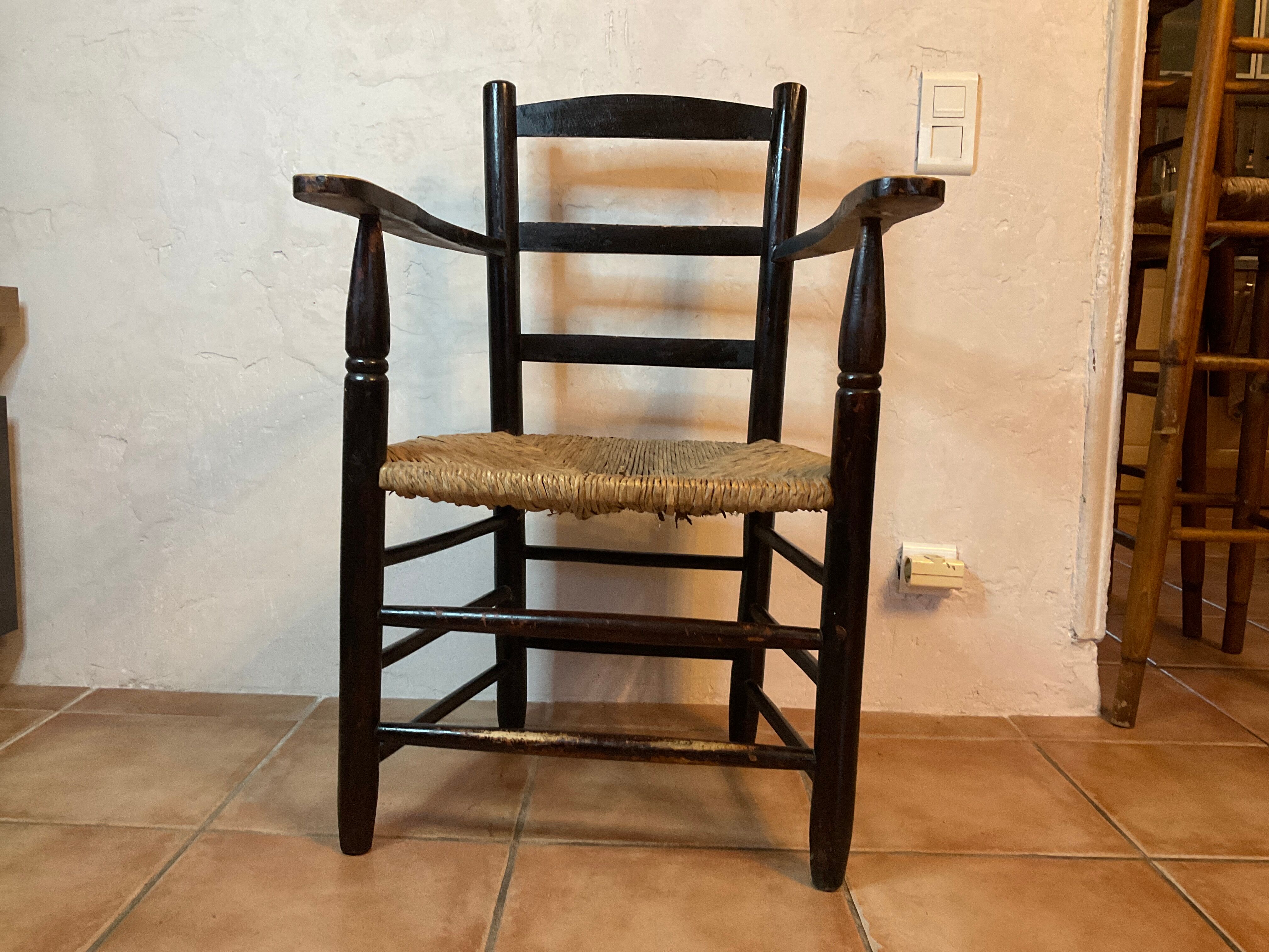 Design armchair of the 20th in straw