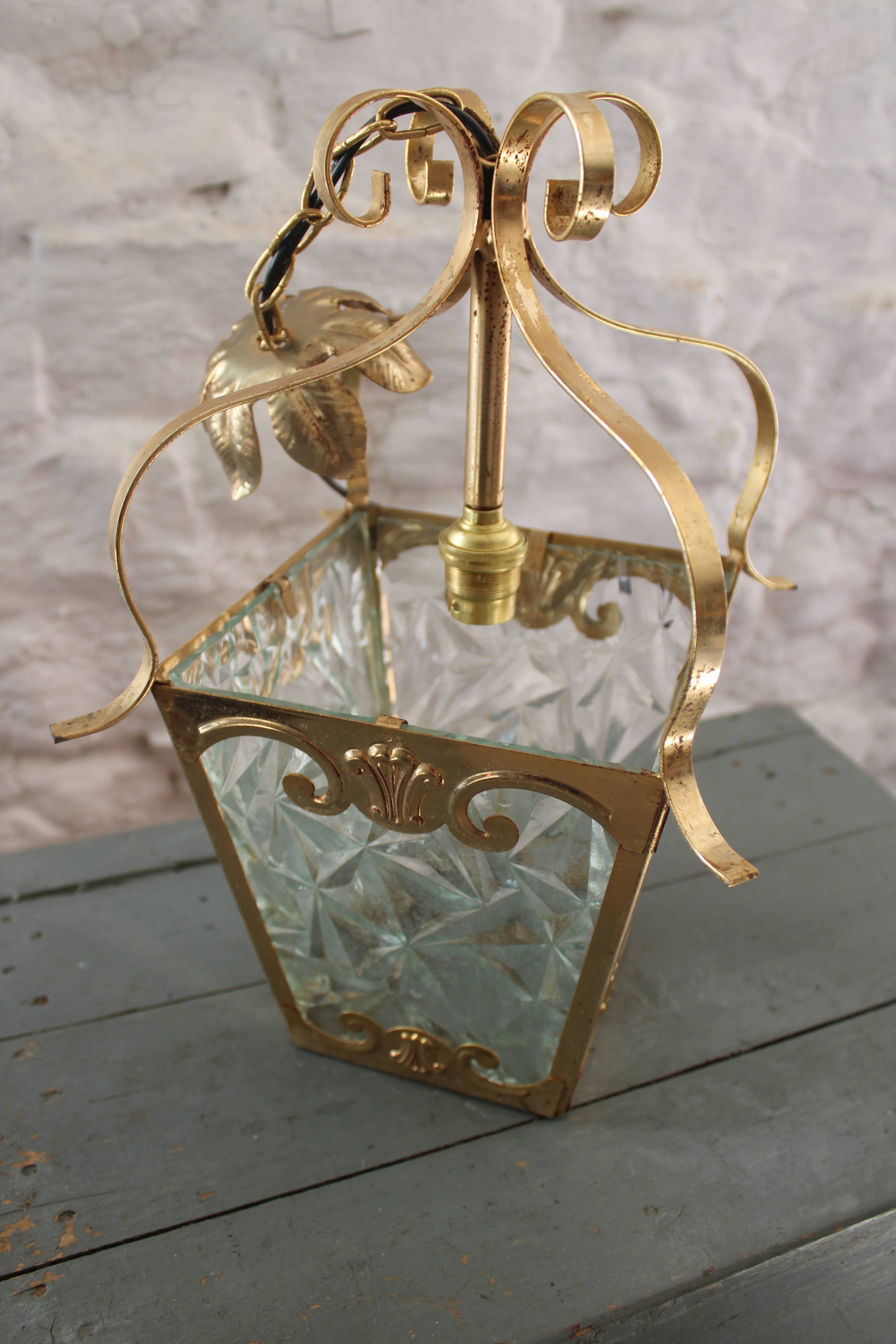 Glass and brass suspension