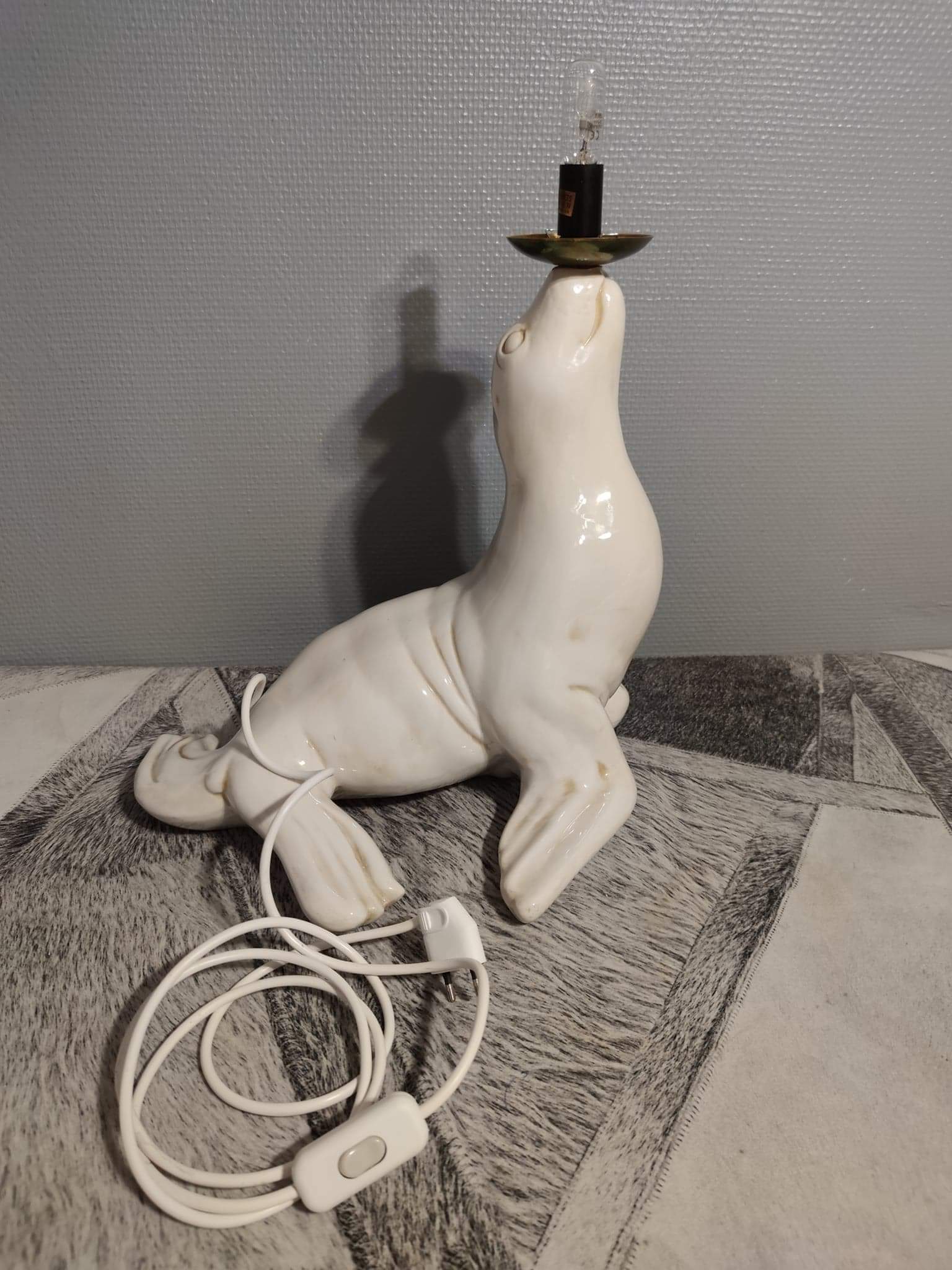 White ceramic sea lion lamp and opaline globe