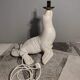 White ceramic sea lion lamp and opaline globe