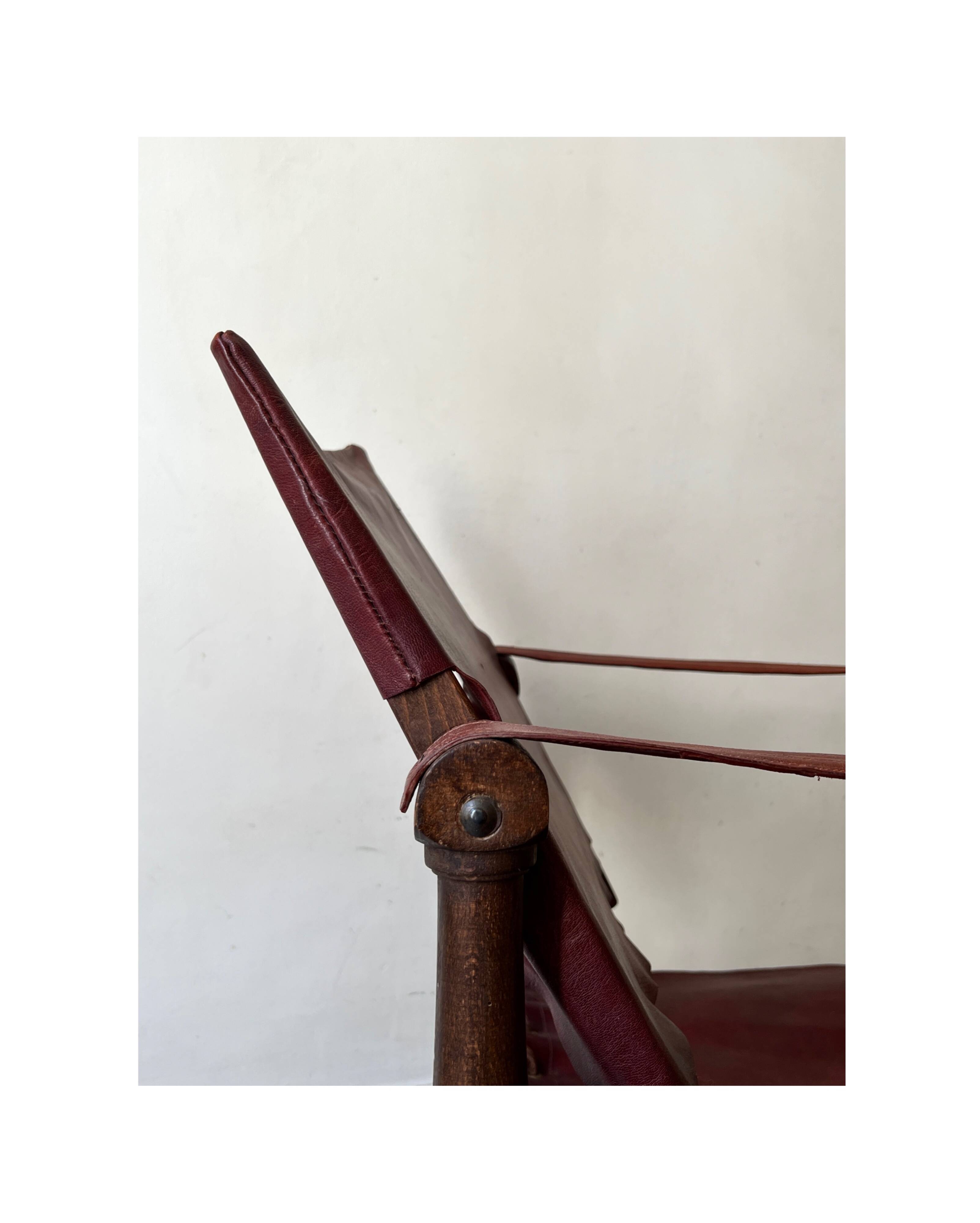 Scandinavian safari armchair in wood & burgundy leather upholstery 20th century
