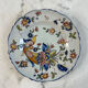 Flat plate in earthenware with polychrome decoration in Rouen style