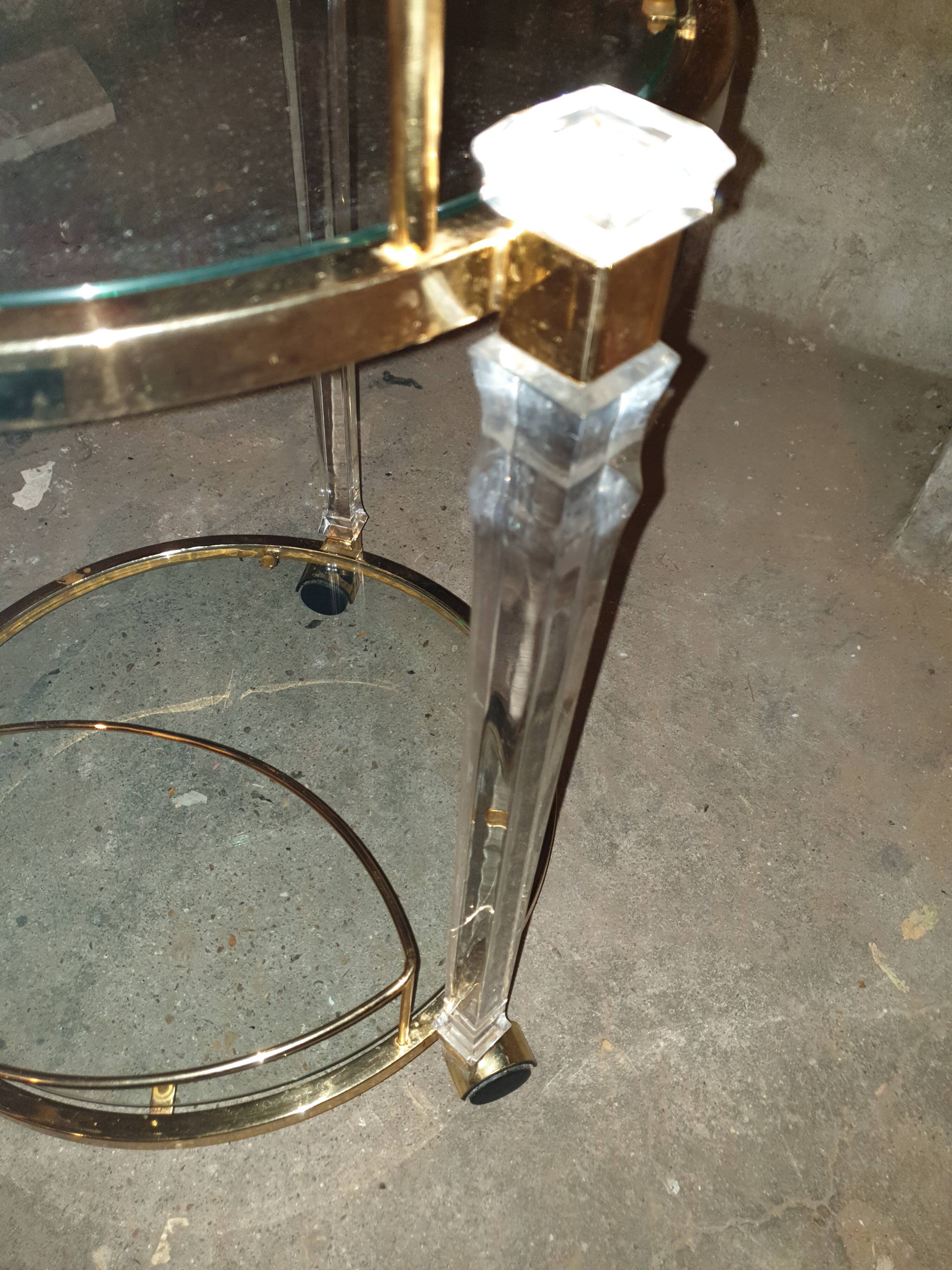 Round table in glass and brass and acrylic columns, 1980