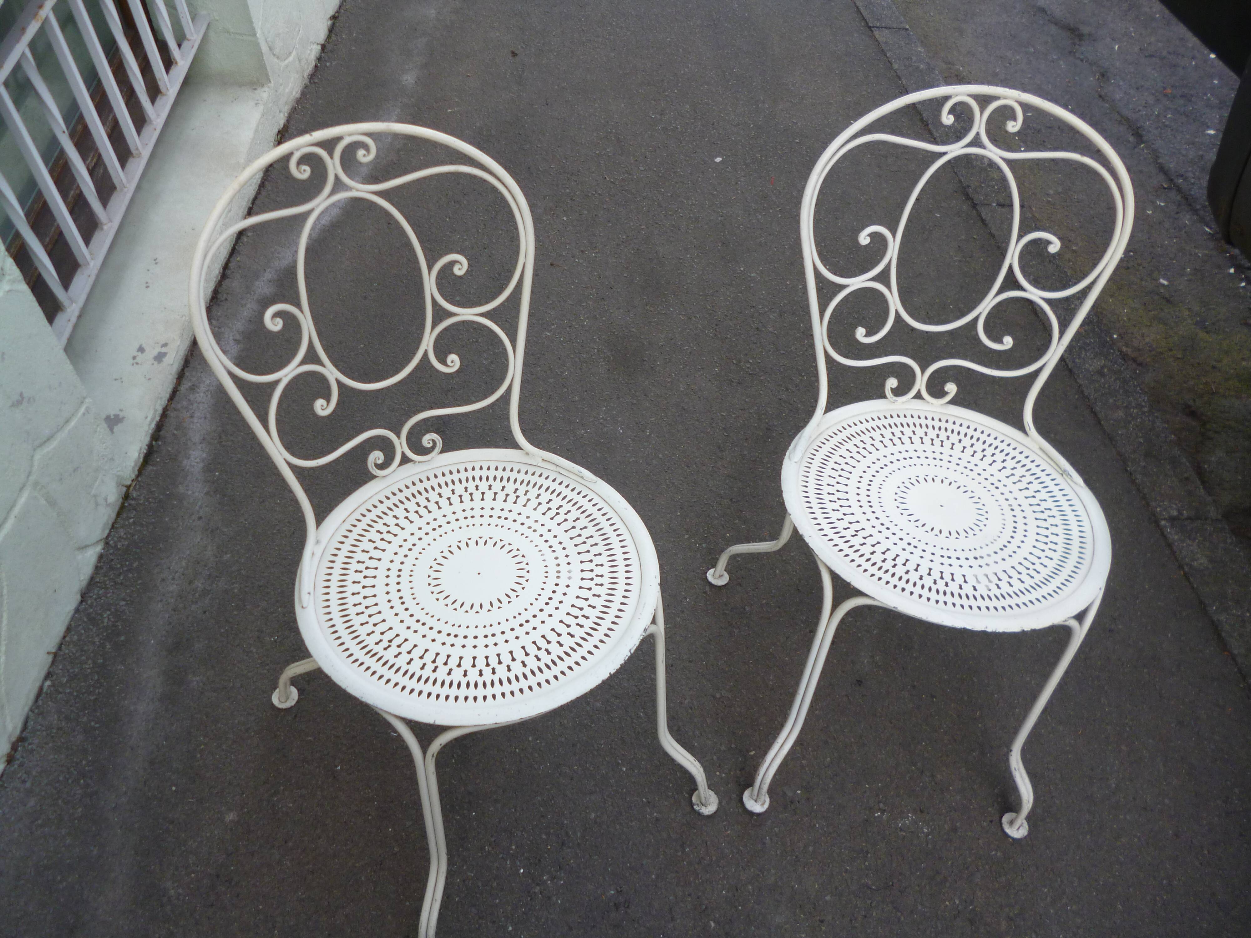 Pair of old wrought iron garden chairs