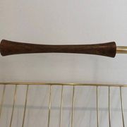 Brass and wood magazine rack, in the style of Cesare Lacca.