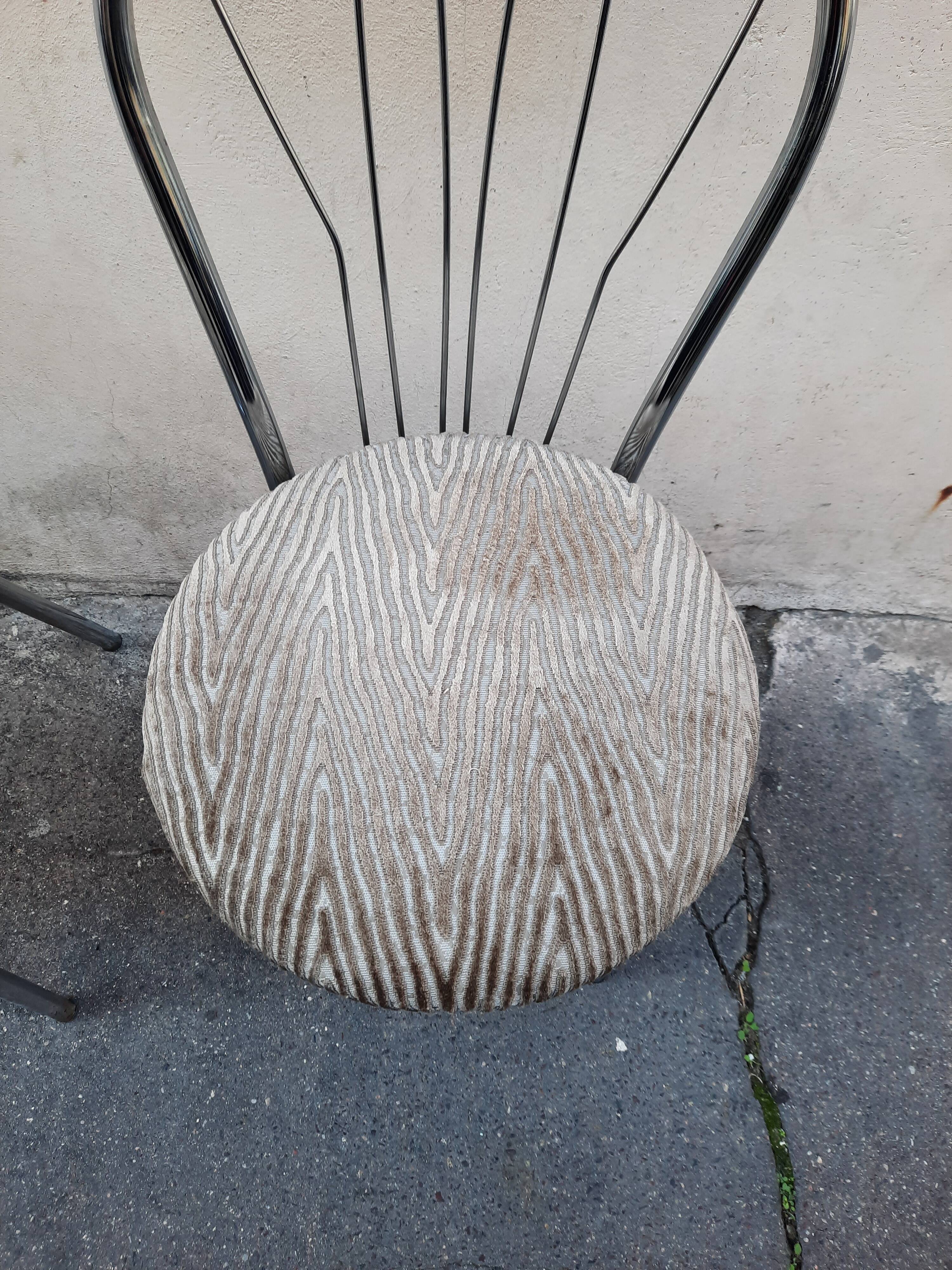 Pair of tubular metal bistro chairs