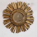 Miroir soleil en bois doré 1950