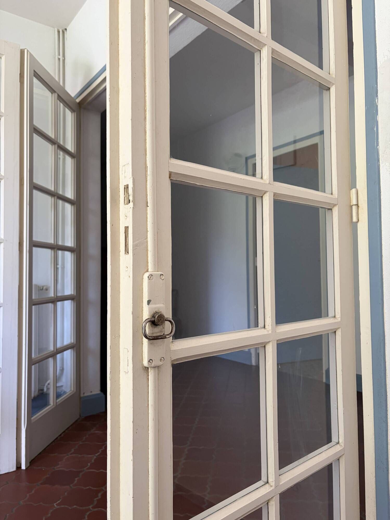 Triptych glass door with three panels featuring small panes. Vintage.