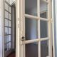 Triptych glass door with three panels featuring small panes. Vintage.