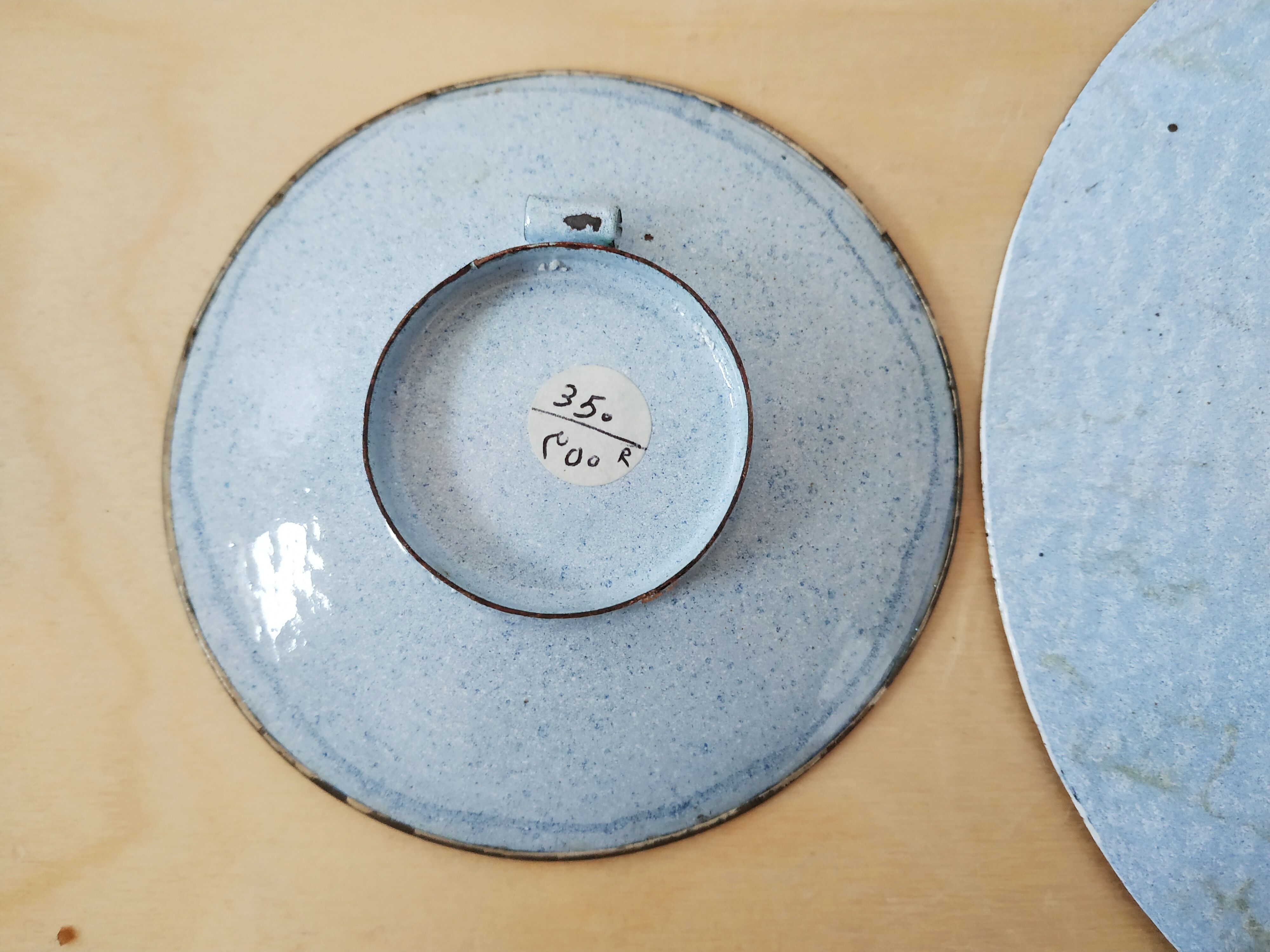 Plate and two decorative saucers enamelled with Persia decoration, circa 1940