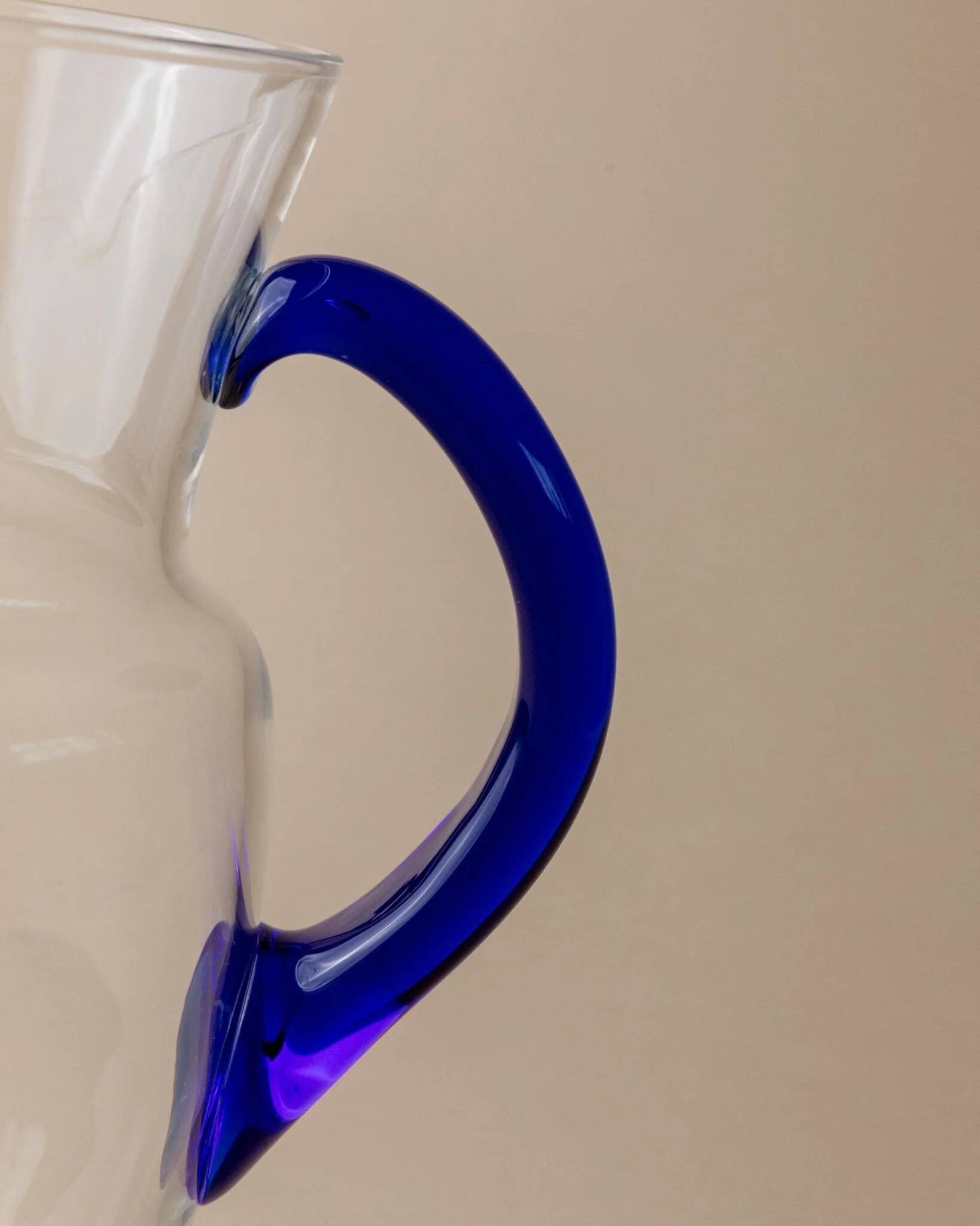 Vintage glass pitcher - clear glass with blue handle - Mid-Century design from Italy in the 1970s - elegant table decoration, retro gift idea.