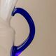 Vintage glass pitcher - clear glass with blue handle - Mid-Century design from Italy in the 1970s - elegant table decoration, retro gift idea.