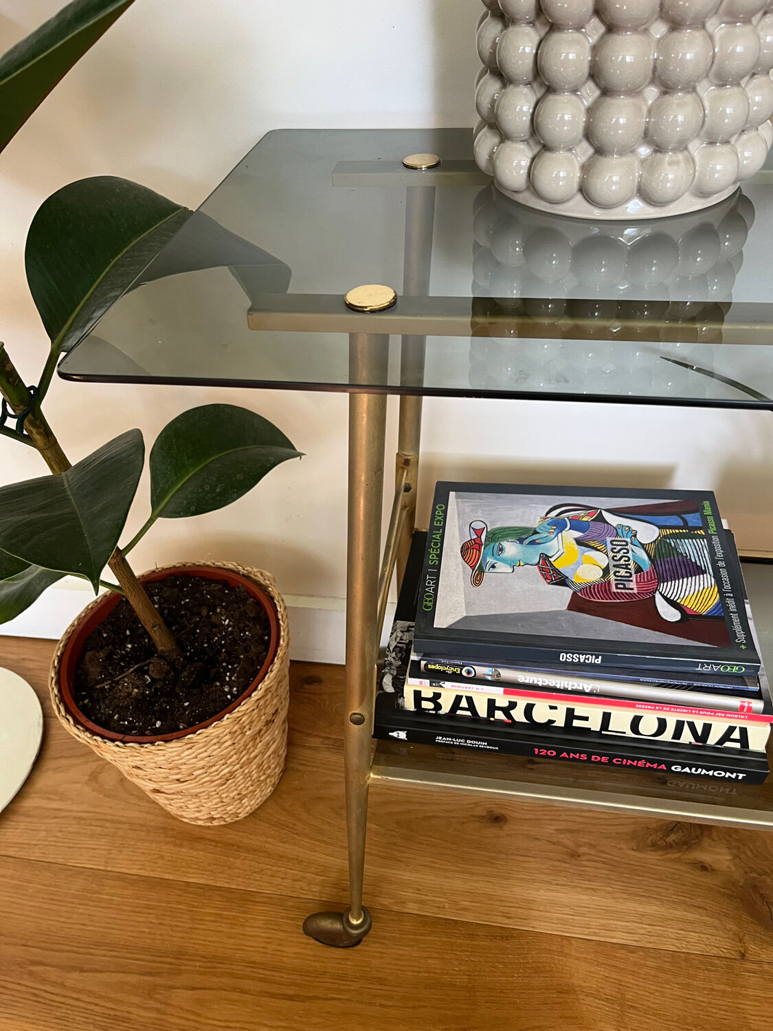 Vintage brass and smoked glass dessert trolley on wheels.