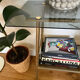 Vintage brass and smoked glass dessert trolley on wheels.