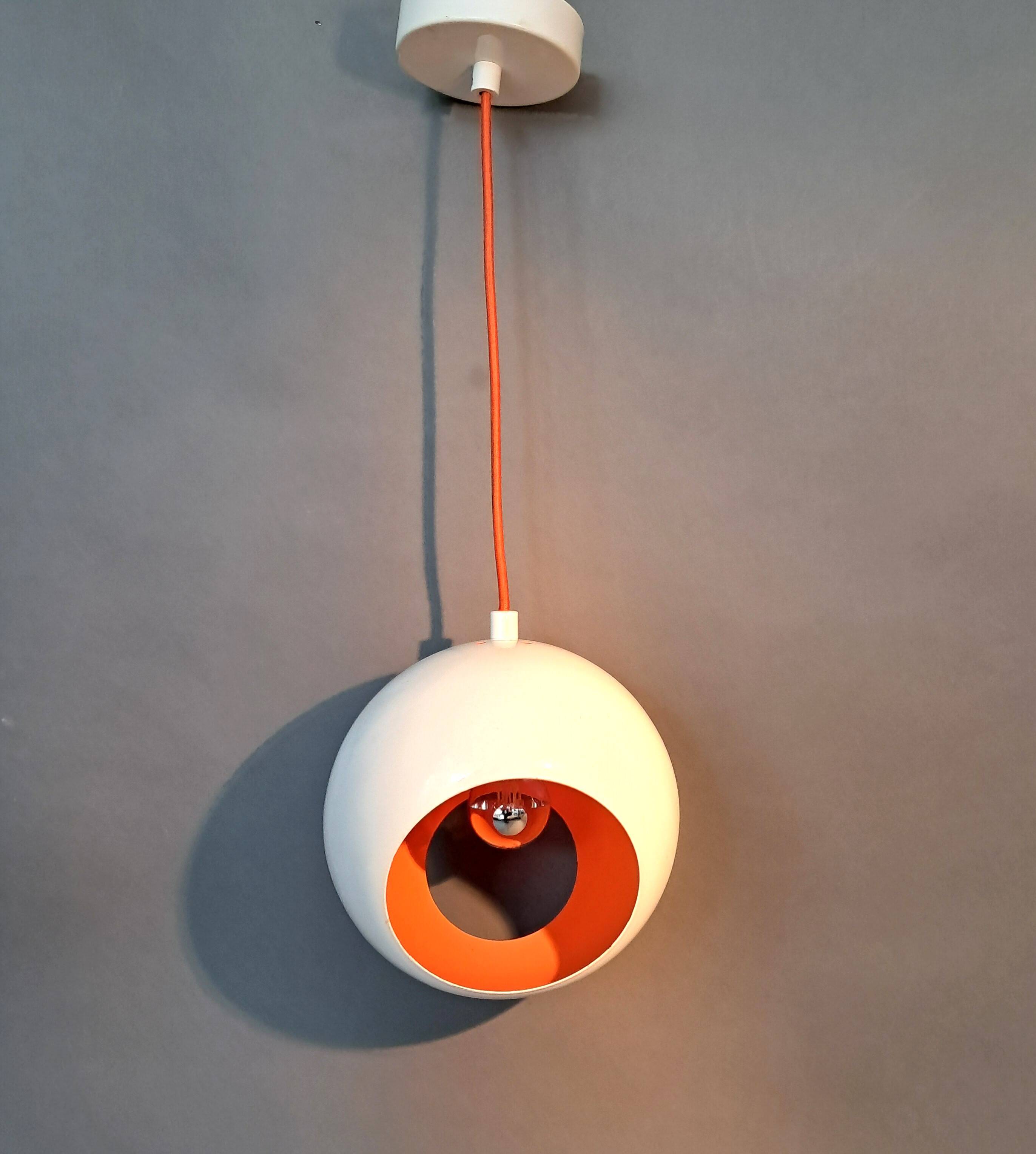 White openwork pendant light with orange interior 1970/1980.