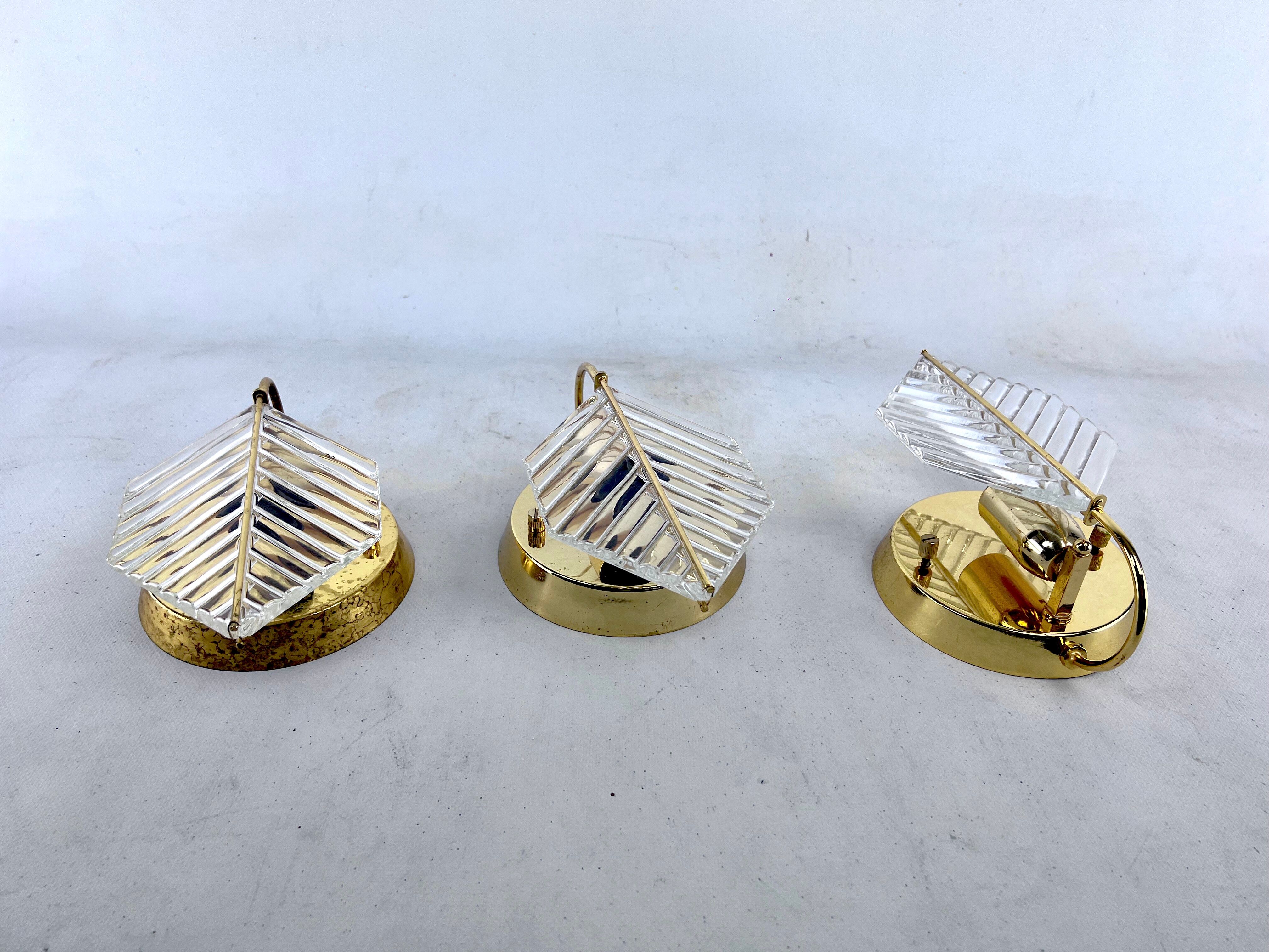 Vintage set of three sconces in brass and glass by Zero Quattro. Italy 1970s