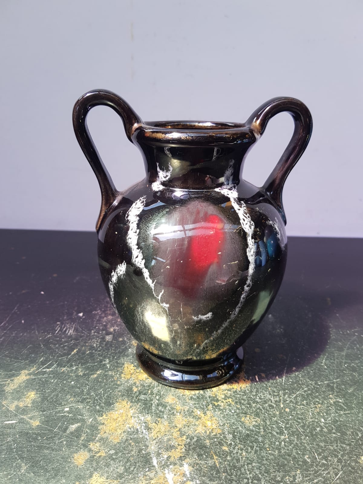 Old vase with coves ceramic black